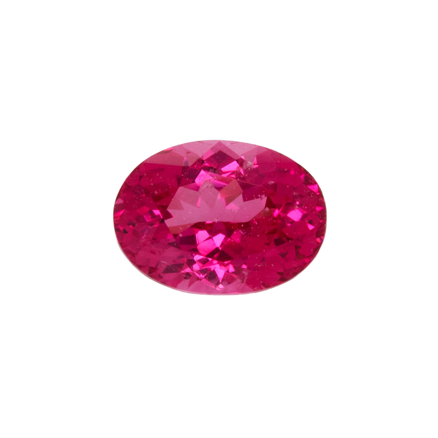 Red gemstone on a white background.