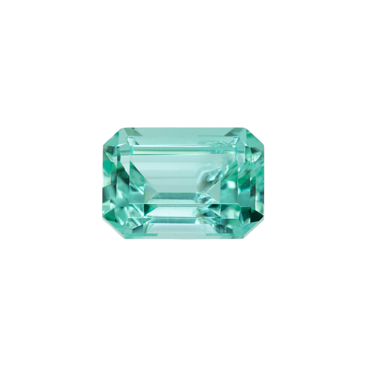 Gemstone with a vibrant mint green color on a white background