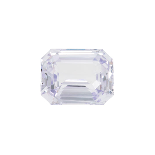 Clear violet gemstone on a white background