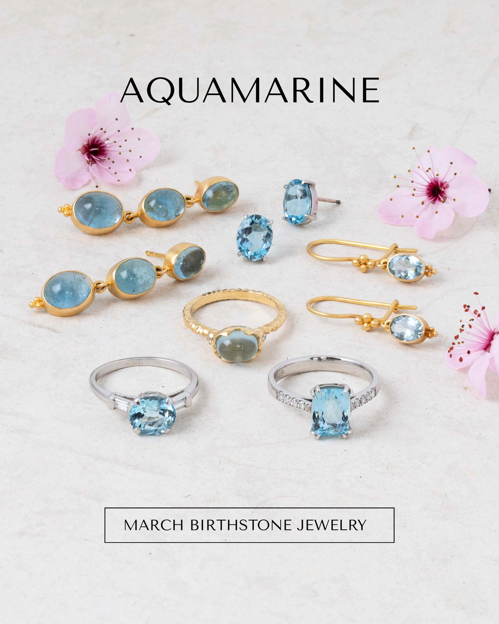 Image: Three pairs of earrings and three rings with aquamarine gemstones on a pale tile background with three cherry blossoms. Text: AQUAMARINE  [MARCH BIRTHSTONE JEWELRY] button.
