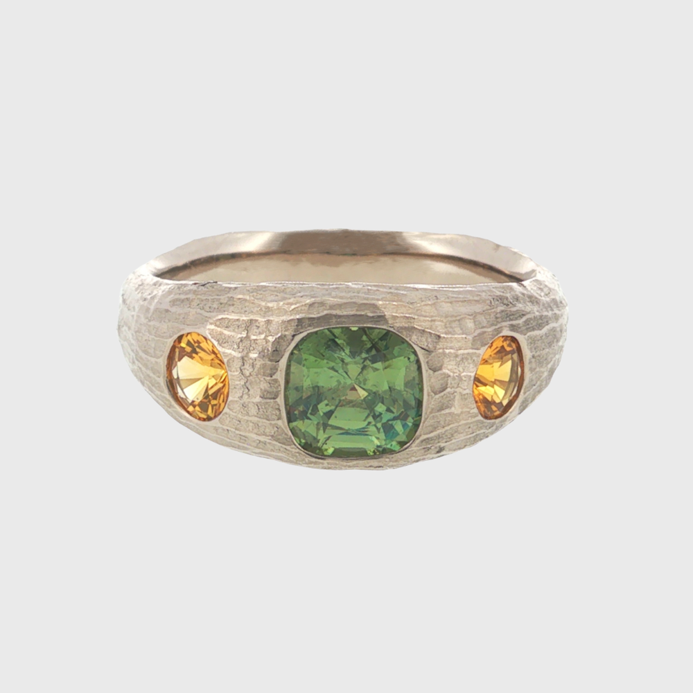 Platinum ring with green and yellow gemstones