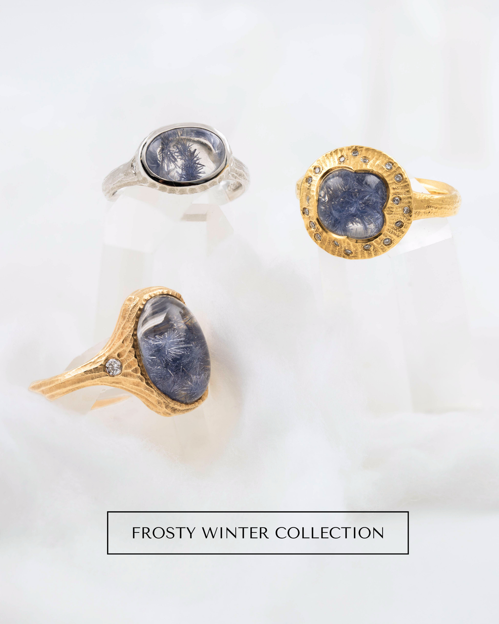 Image: Four rings with dumortierite quartz on a white crystal background. [FROSTY WINTER COLLECTION] button.
