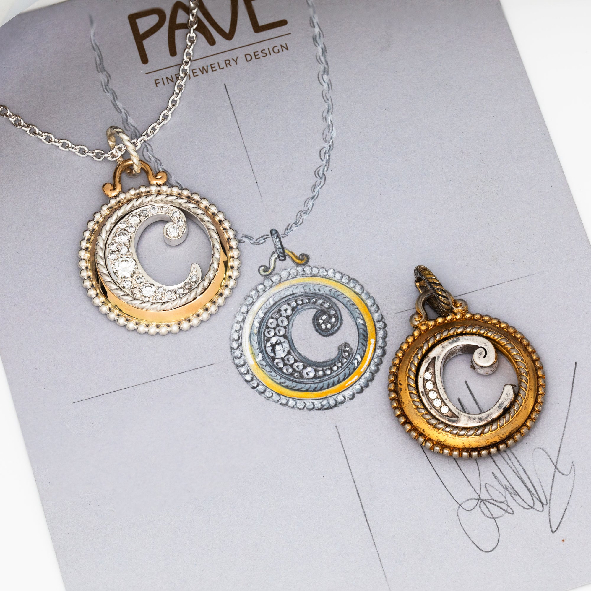 Three circular pendants on a chain with 'PAVE' branding in the background