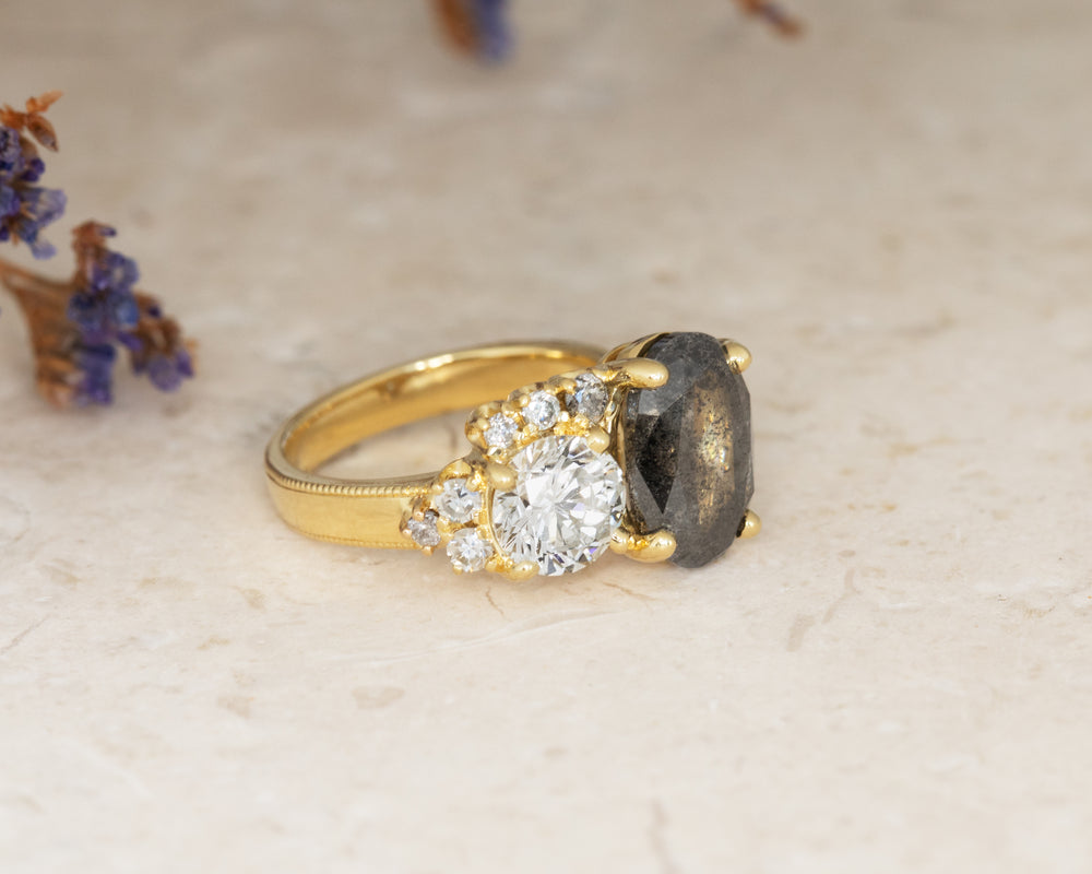 Gold ring with a gemstones on a light background