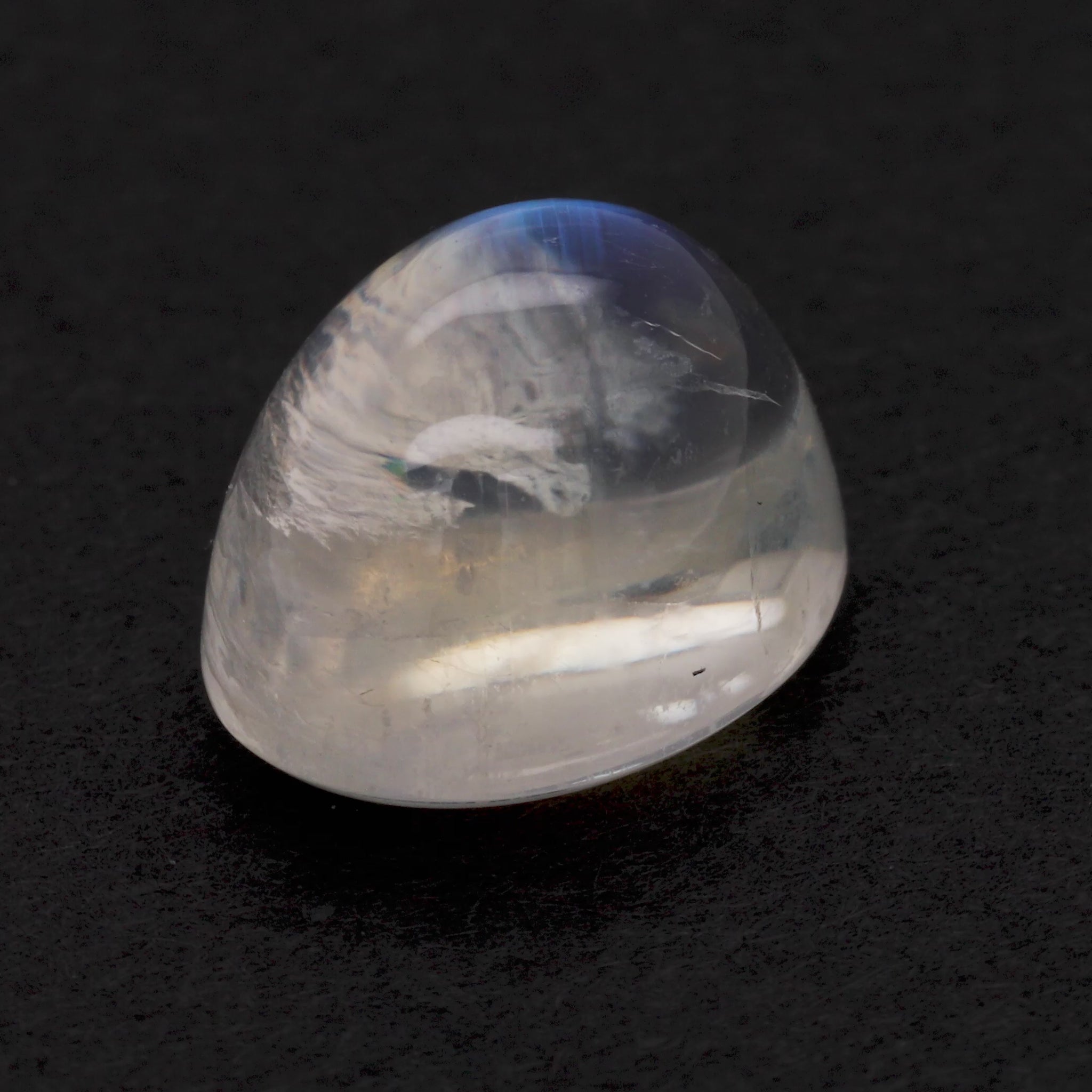 Moonstone gemstone on black background