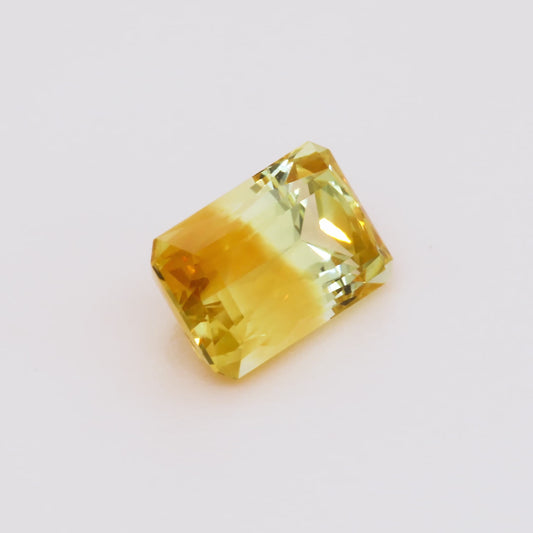 Yellow sapphire gemstone on a white background